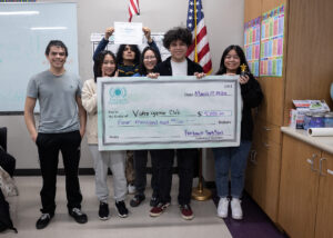 Image of the Video Game Club receiving their grant award.