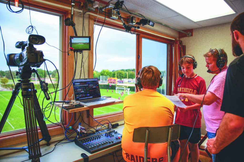 Students in broadcasting booth